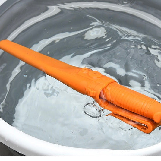 Floating utility knife is foating in a bucket filled with water — NZ fishing Don Fish Gear